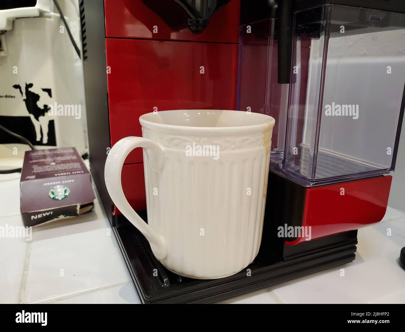 A mug is visible in a Nespresso coffee maker, Lafayette, California, March 30, 2022. Photo courtesy Sftm. Stock Photo