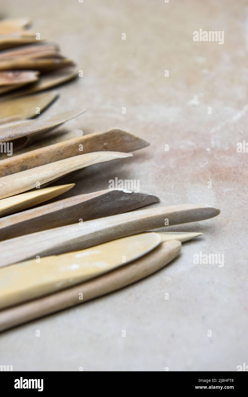 Wooden pottery tools set on a ceramics studio background Stock Photo