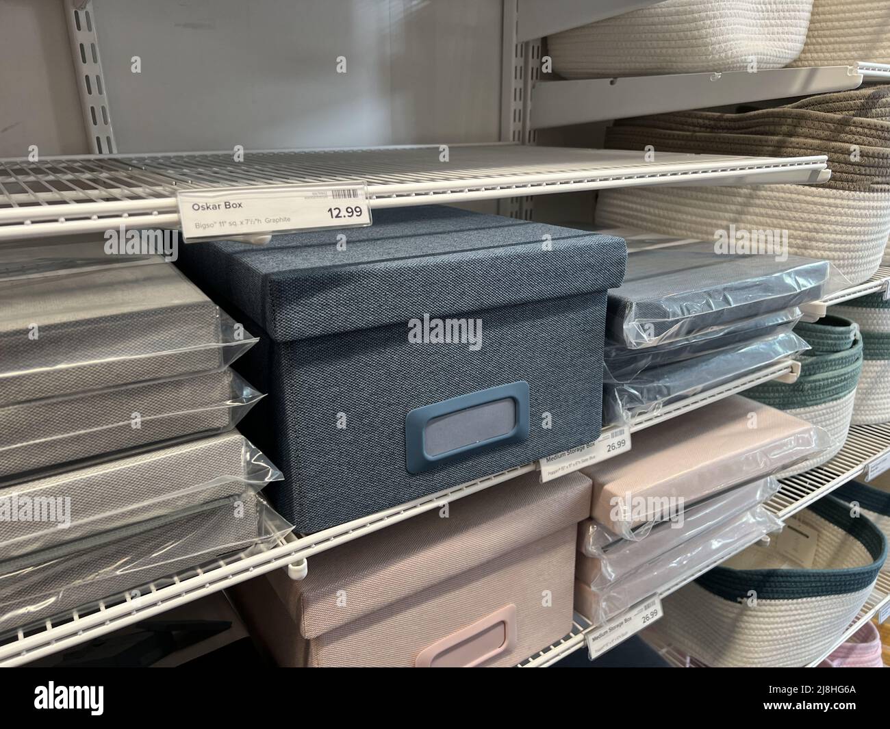 Storage containers are visible on shelves at the Container Store