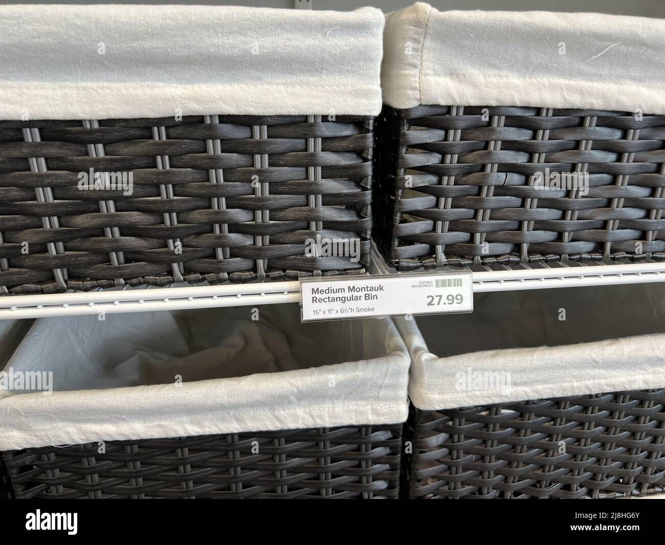 Storage containers are visible on shelves at the Container Store