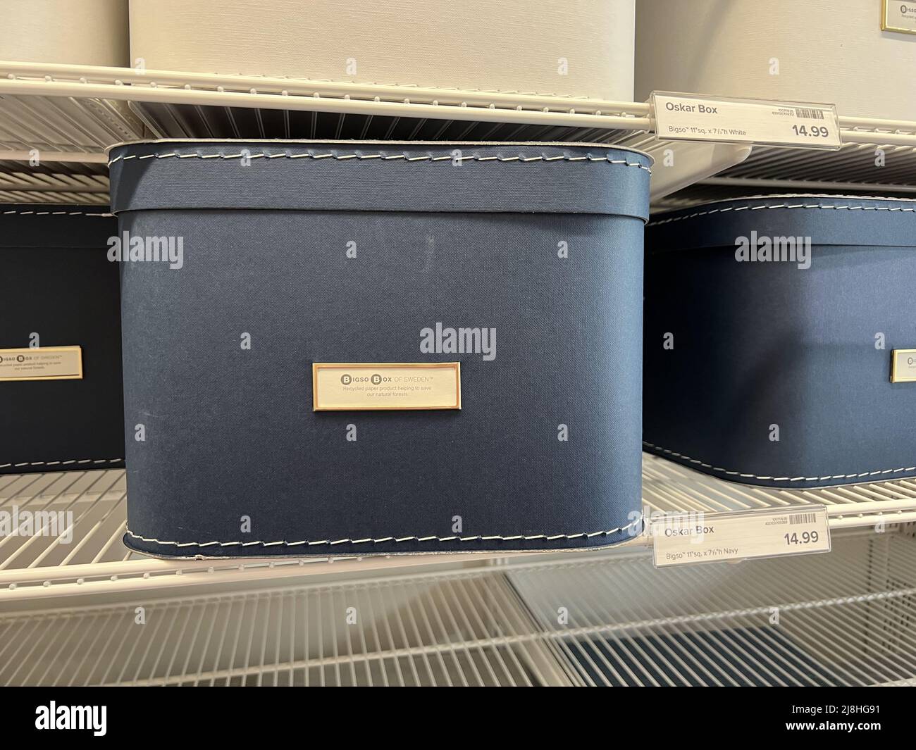 Storage containers are visible on shelves at the Container Store