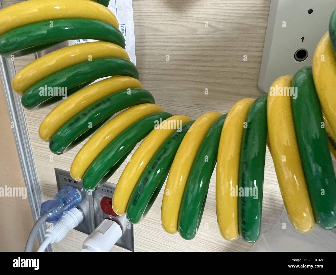 Coiled medical air and oxygen hoses in a hospital setting in San