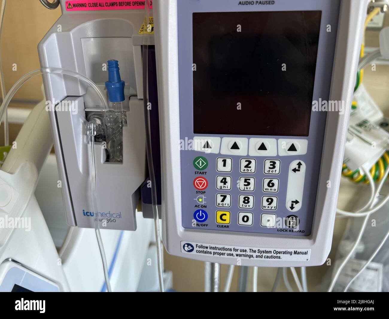 Close-up of an ICU Medical intravenous infusion pump in a hospital setting in San Francisco, California, May 4, 2022. Stock Photo