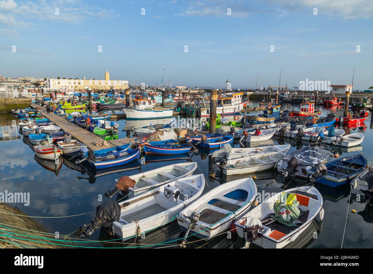 Sesimbra, Portugal - 13 March 2022: view of the harbor and village of Sesimbra in Portugal with colorful fishing boats Stock Photo