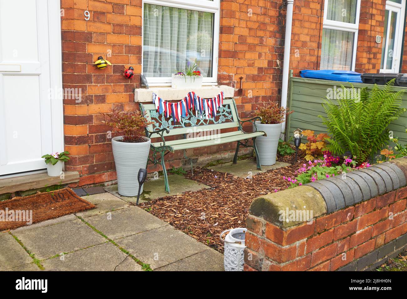Bunting on a garden bench in Breaston, Derbyshire, UK Stock Photo Alamy