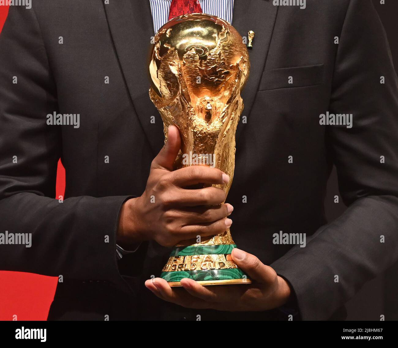 Kuwait City. 16th May, 2022. Brazilian former soccer player Gilberto Silva displays the World Cup trophy during a FIFA World Cup Trophy Tour event in Kuwait City, Kuwait, May 16, 2022. Credit: Xinhua/Alamy Live News Stock Photo