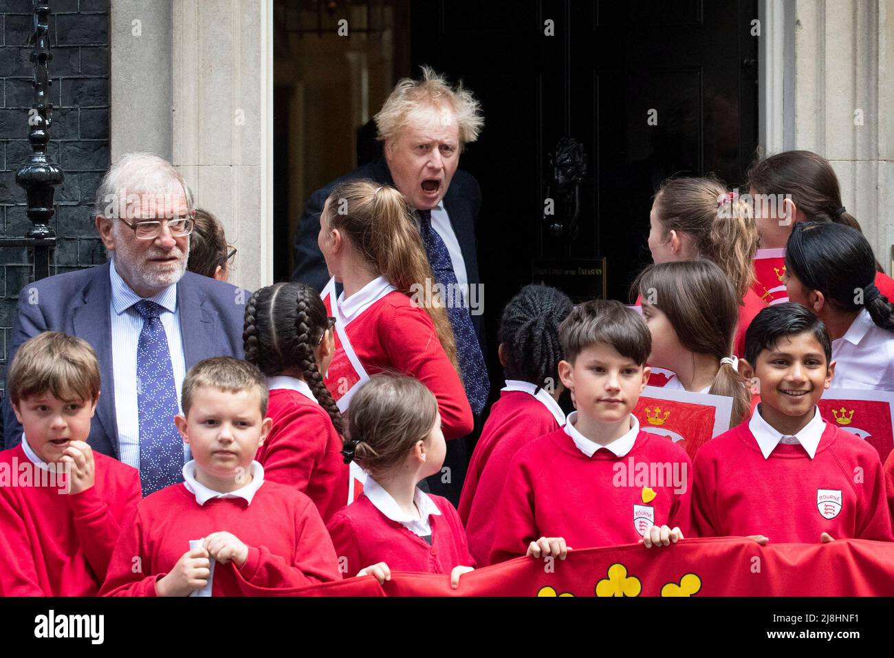 British Prime Minister Boris Johnson, greets children from Bourne Junior School, Middlesex at Number 10 Downing Street, London on Middlesex Day. Stock Photo