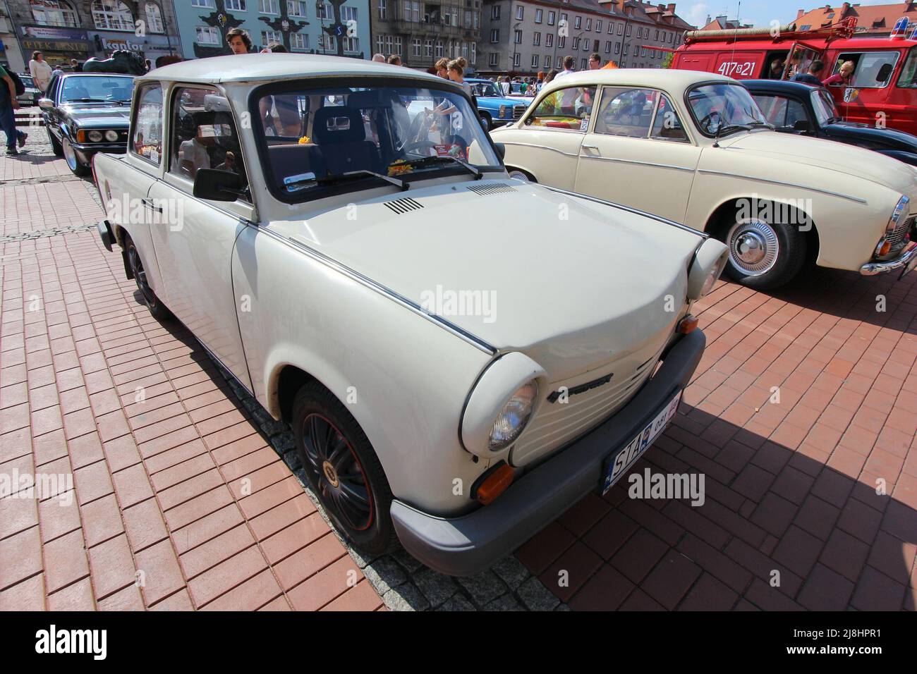 BYTOM, POLAND - SEPTEMBER 12, 2015: People walk by Trabant 601 oldtimer car during 12th Historic Vehicle Rally in Bytom. The annual vehicle parade is Stock Photo