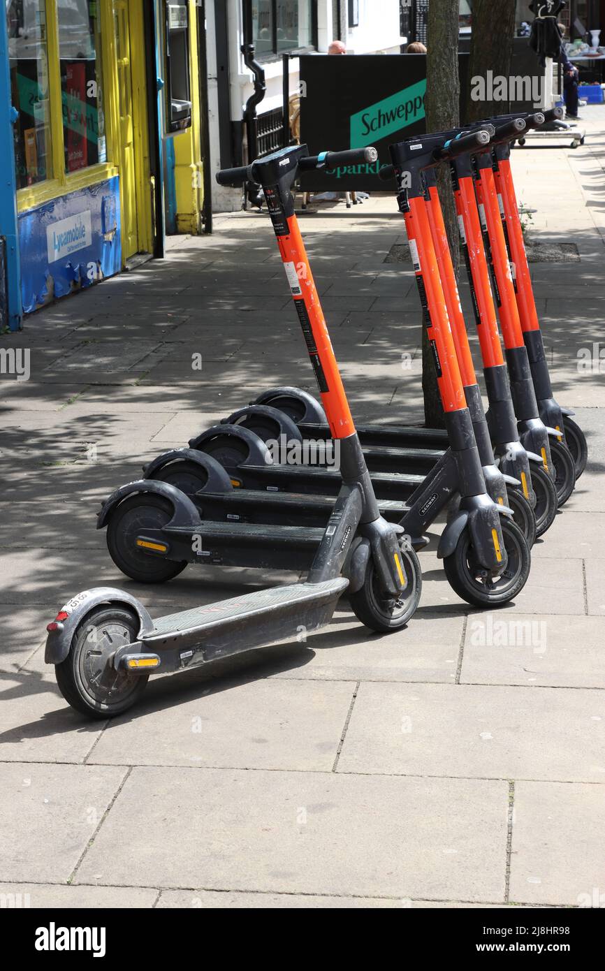Rental EScooters parked together on pavement in City of Chelmsford