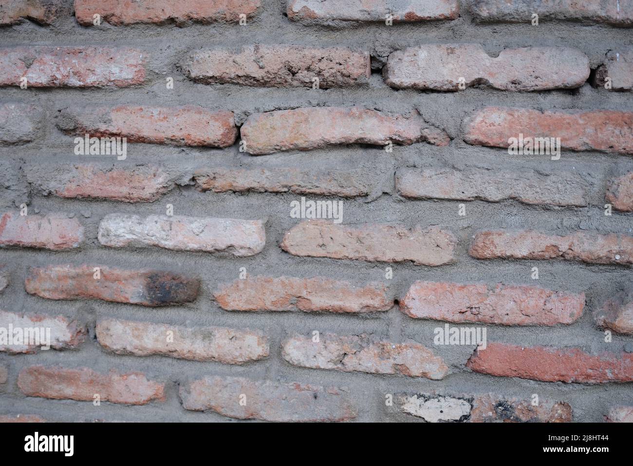 Old red brick wall surface background for home or office design Stock Photo