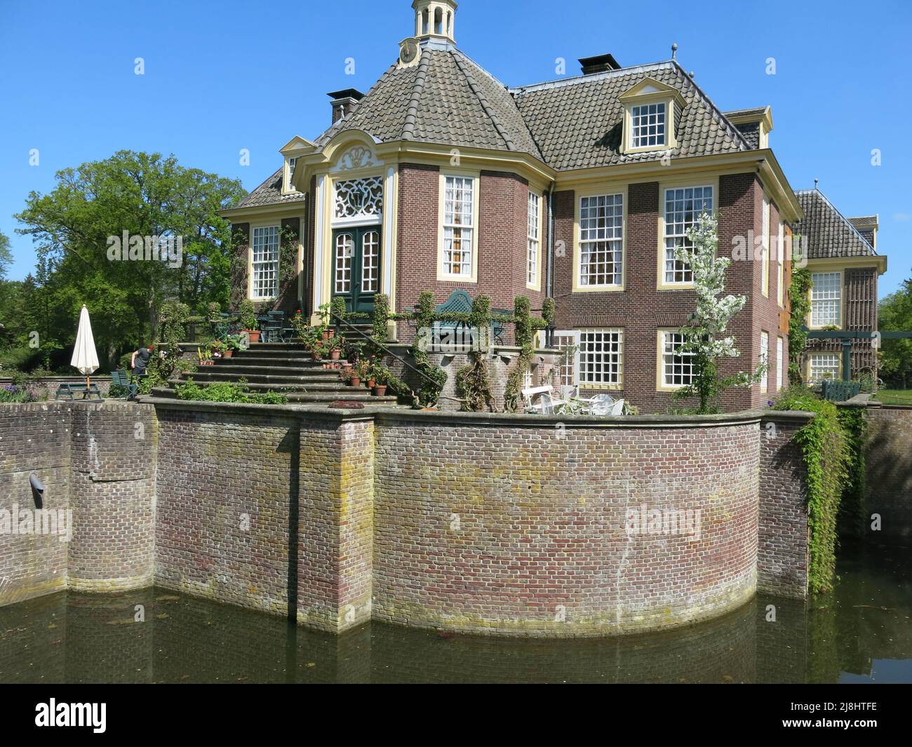 The moated manor house of De Wiersse, set within 40 acres of garden and landscaped parkland; Vorden, Gelderland, The Netherlands. Stock Photo