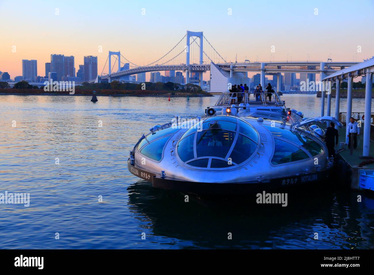 TOKYO, JAPAN - DECEMBER 2, 2016: People ride Hotaluna tour cruise boat in Tokyo, Japan. Tokyo is the capital city of Japan. 37.8 million people live i Stock Photo