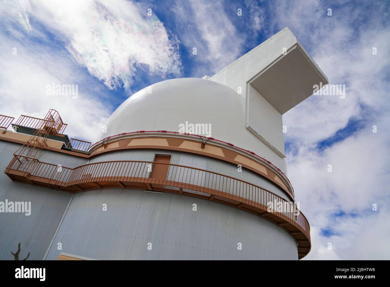 Low angle view of the University of Hawaii 2.2-meter telescope at the summit of the Mauna Kea volcano on the Big Island of Hawaii, United States Stock Photo