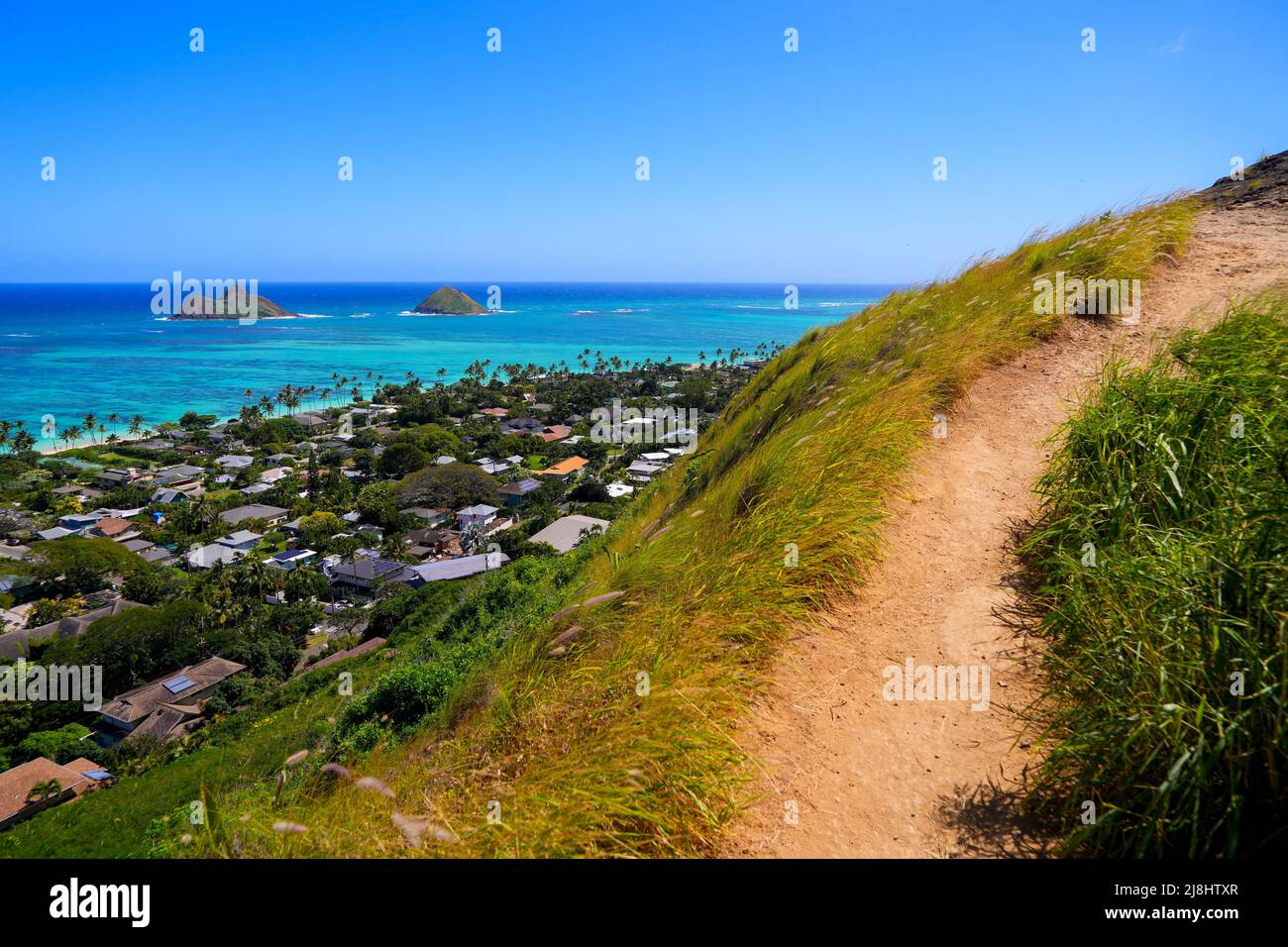 Dirt path of Lanikai Pillbox hike in Kailua, offering a view over