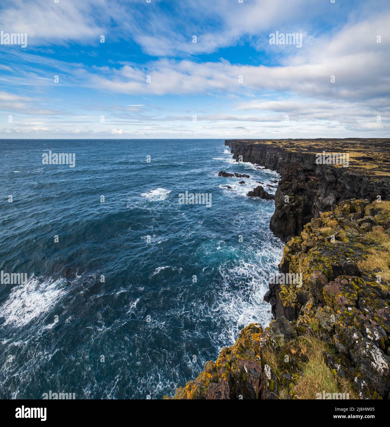 View during auto trip in West Iceland highlands, Snaefellsnes peninsula, View Point near Svortuloft Lighthouse. Spectacular black volcanic rocky ocean Stock Photo