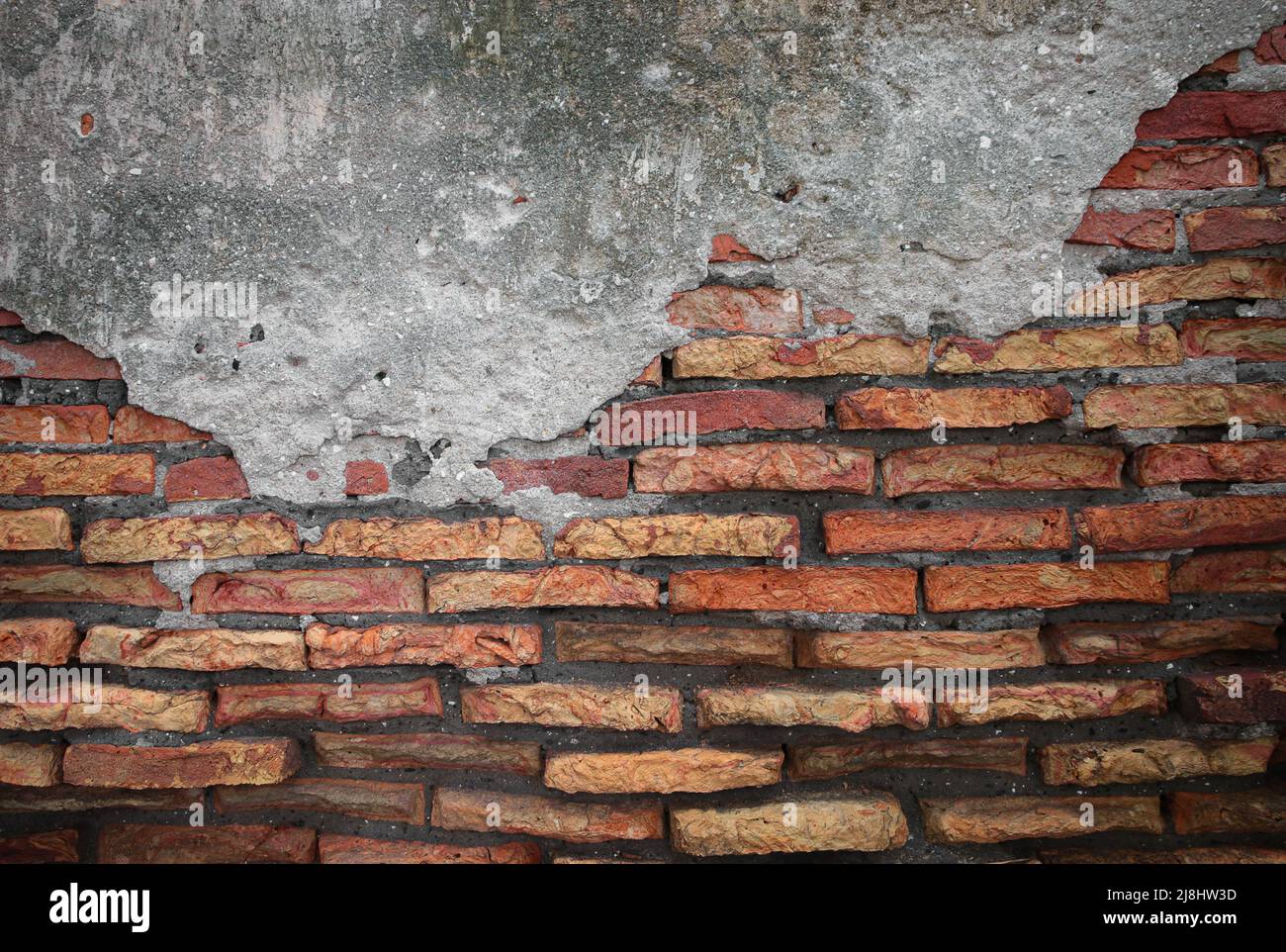red brick block wall texture old background. ancient weathered wall with crack Stock Photo