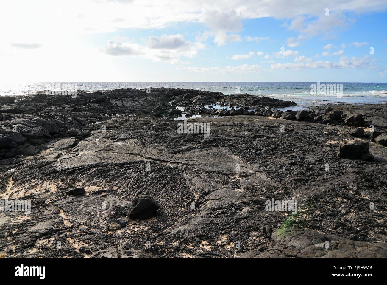 Solidified lava on the sandy O'oma Beach near KailuaKona in the west
