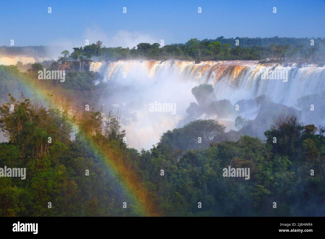 Iguazu Falls landscape and rainbow - natural wonder in Argentina. Stock Photo