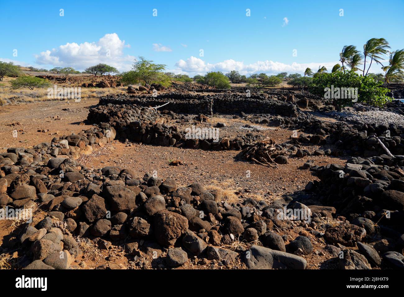 Ruins of traditional Hawaiian houses (Hale) in the ancient fishing village of the Lapakahi State Historical Park on the island of Hawai'i (Big Island) Stock Photo