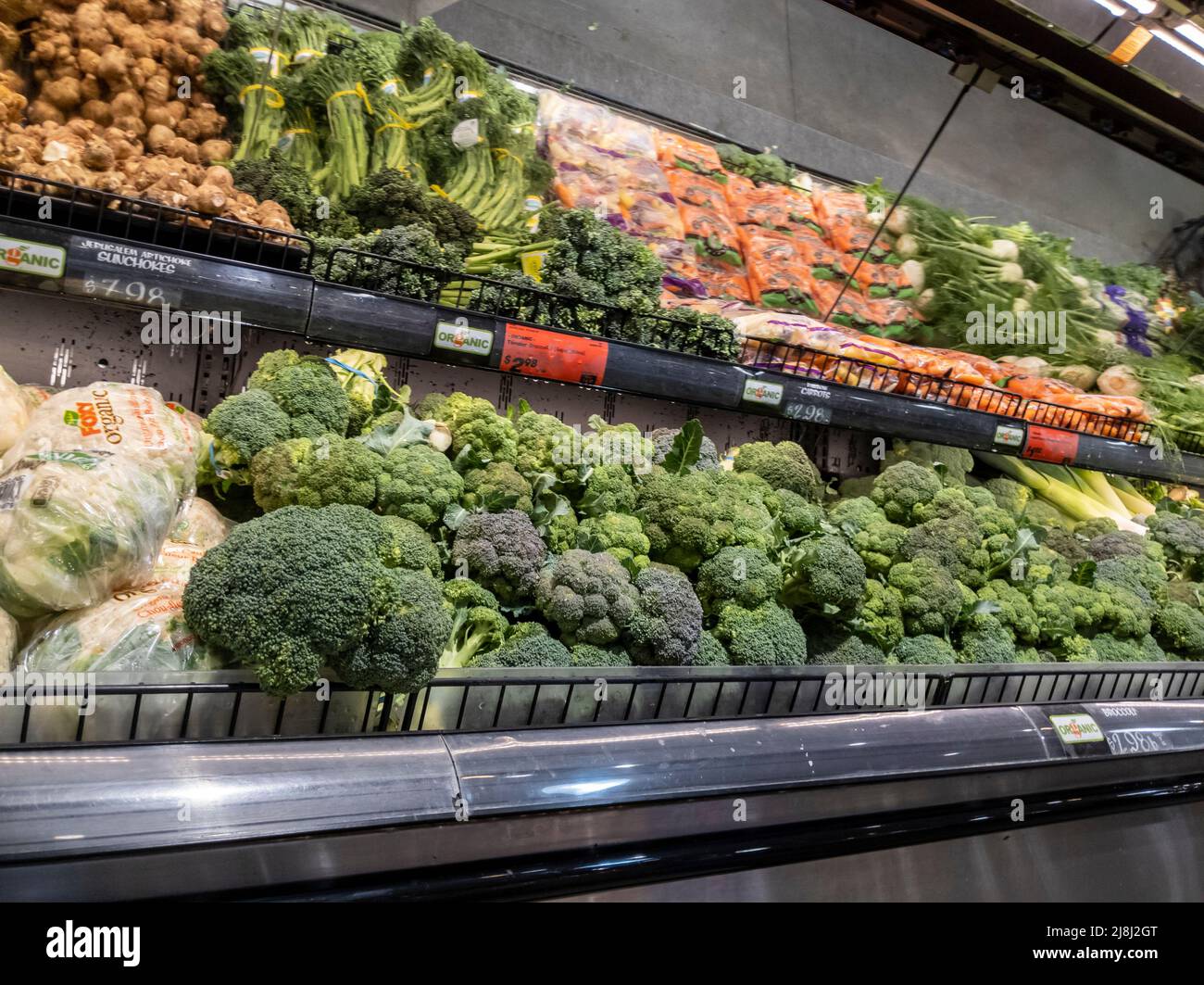 Mill Creek, WA USA - circa April 2022: Angled view of broccoli, cauliflower, and carrots for sale in the produce department of a Town and Country groc Stock Photo