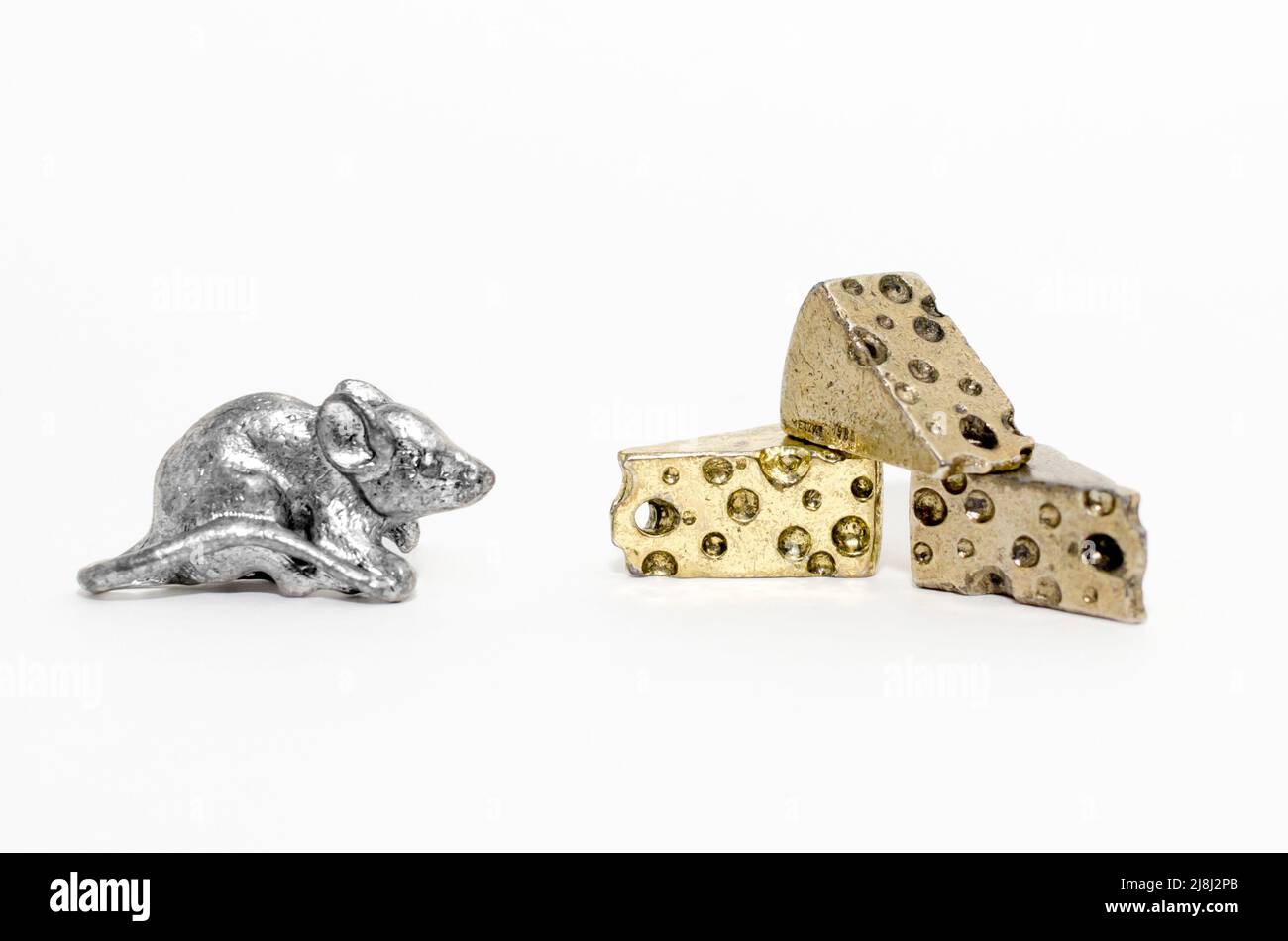 https://c8.alamy.com/comp/2J8J2PB/silver-pewter-mouse-miniature-figurine-facing-three-gold-swiss-cheese-wedges-2J8J2PB.jpg