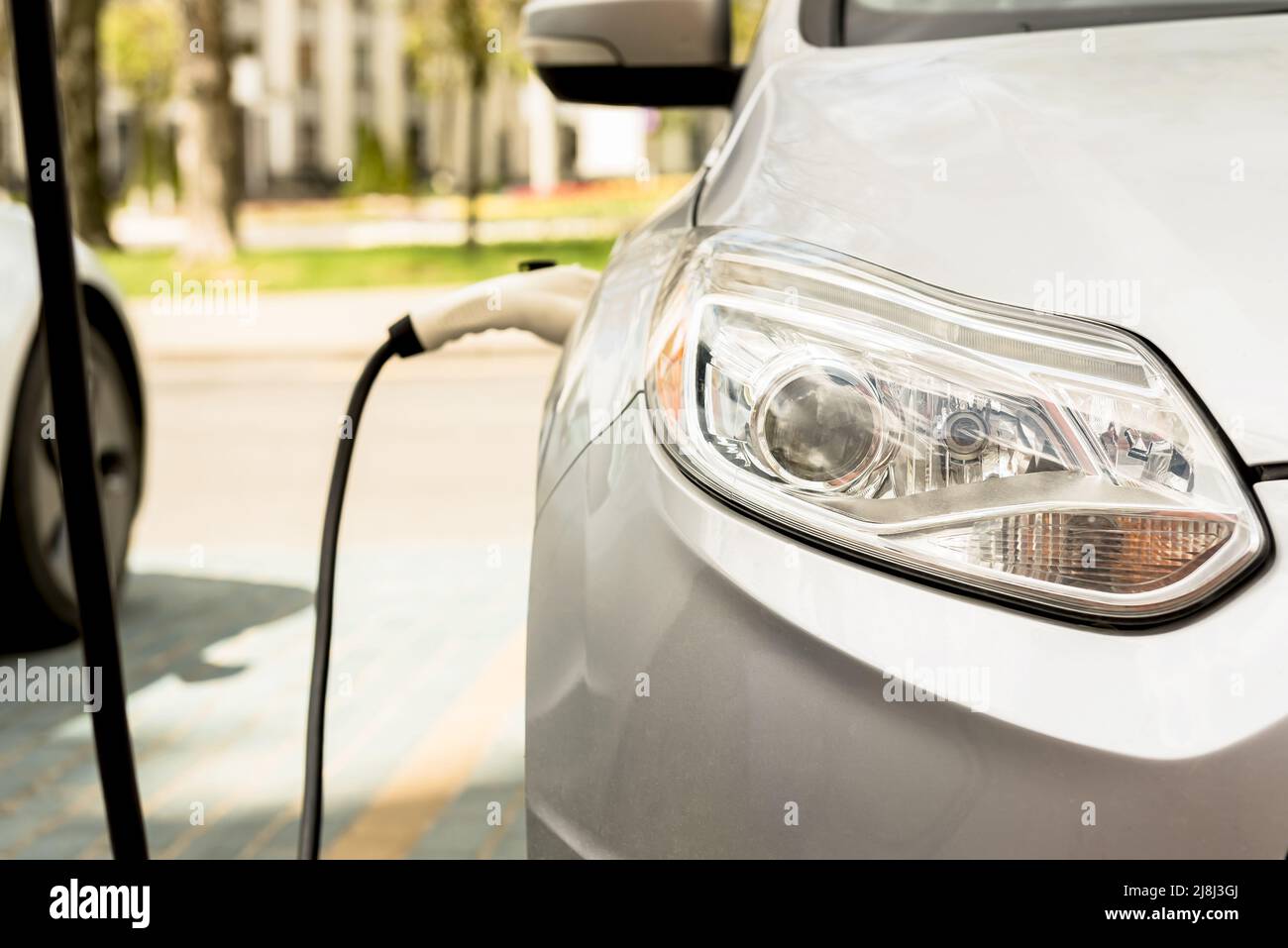 Image showcasing Electric car at the charging station. Ecology. Eco-friendly transport ...