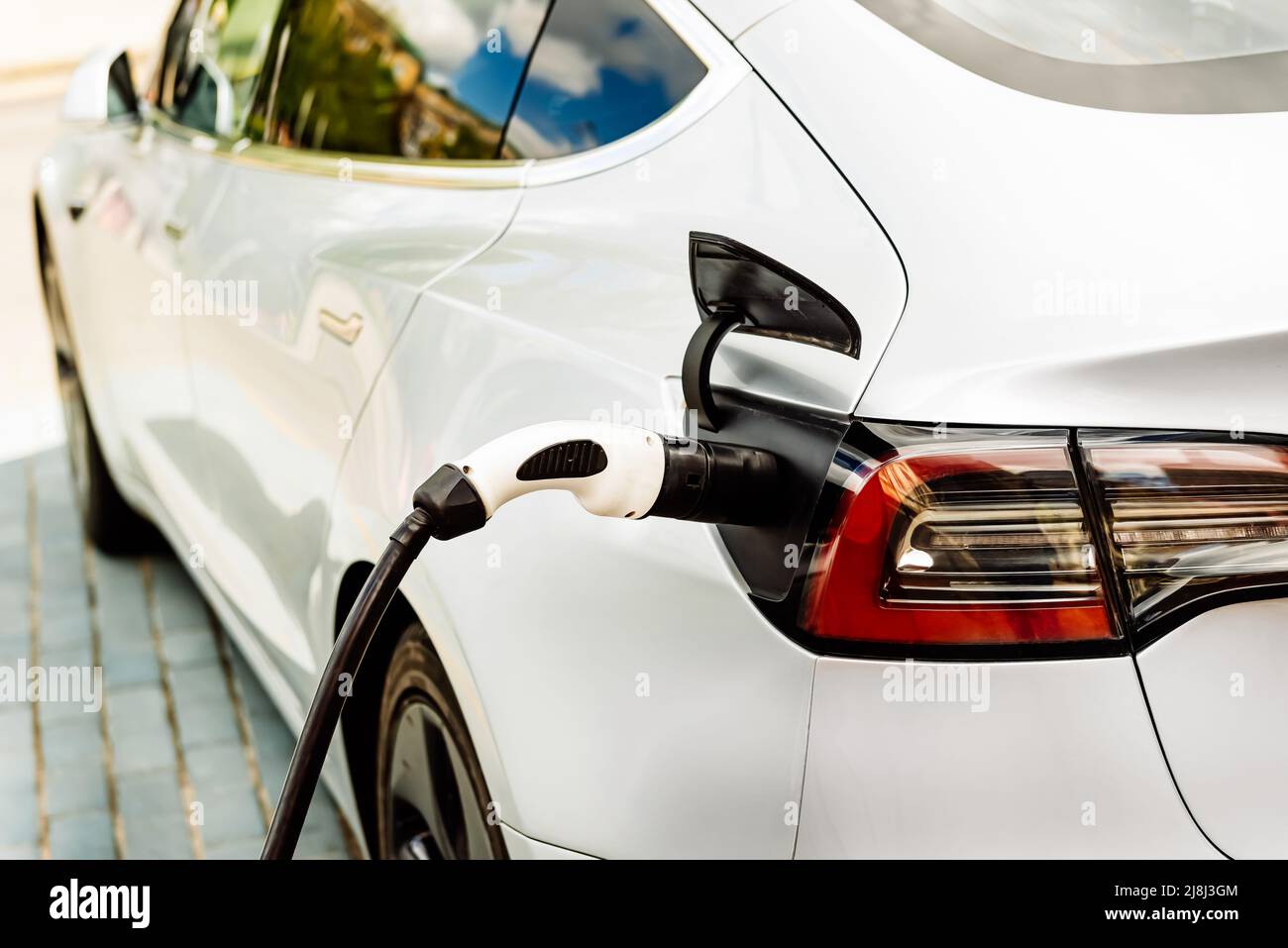View of Electric car at the charging station. Ecology. Eco-friendly transport ...