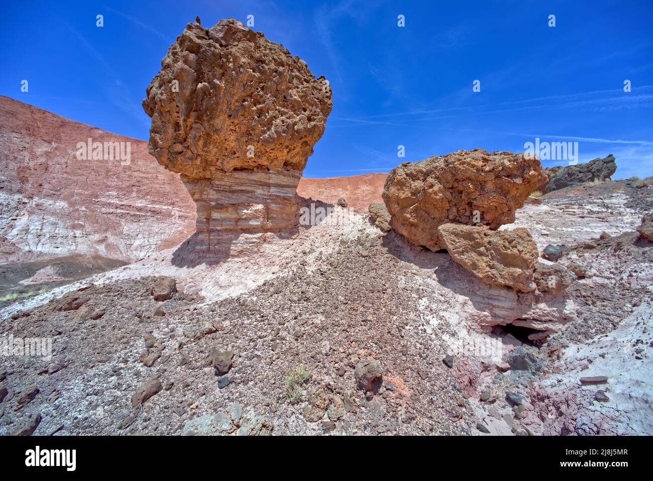 Balanced boulder below the cliffs of Pintado Point in Petrified Forest National Park Arizona. Stock Photo