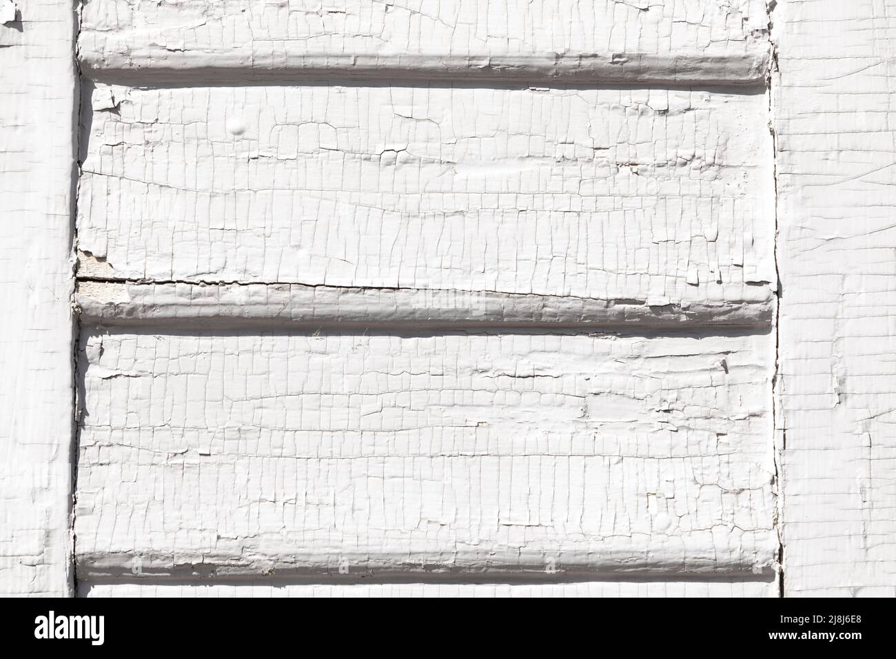 detail of old wooden shutter blind with rotten and cracked white paint ...