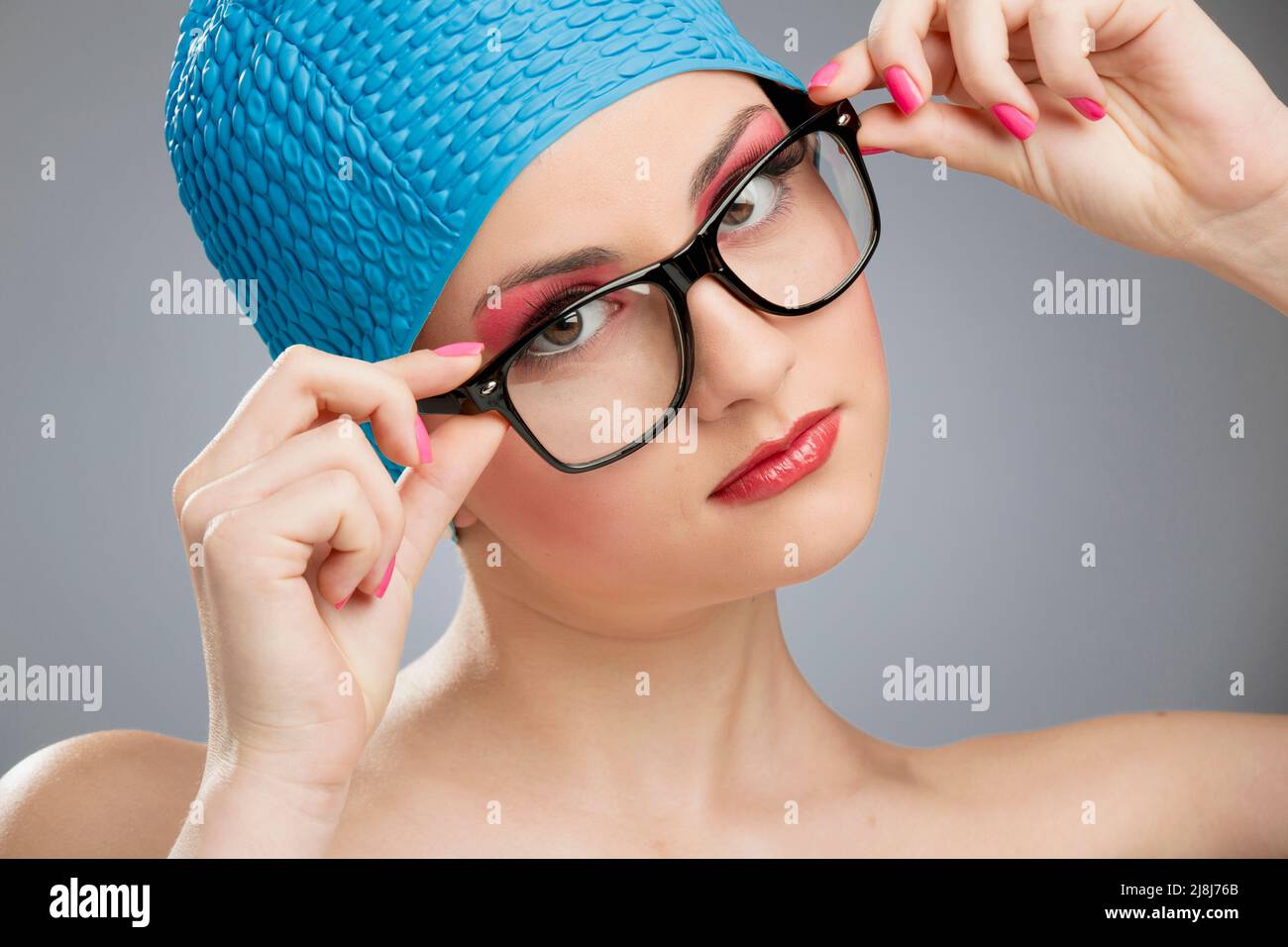 Portrait of a beautiful woman wearing a swim cap Stock Photo
