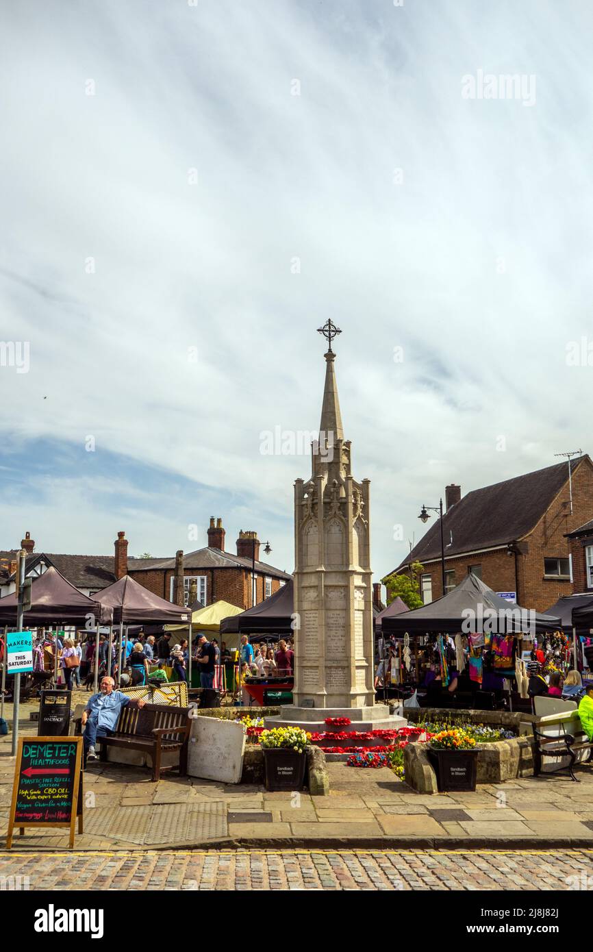 People at the farmers  and makers market around the  cobbled  market square of the Cheshire market town of Sandbach England Stock Photo
