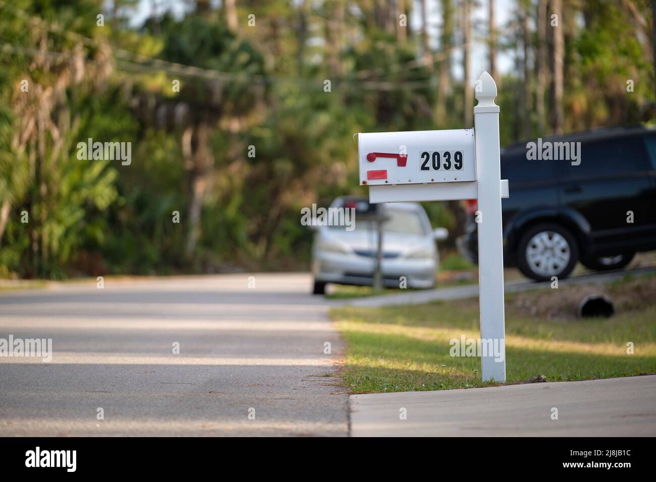 Typical american outdoors mail box on suburban street side Stock Photo
