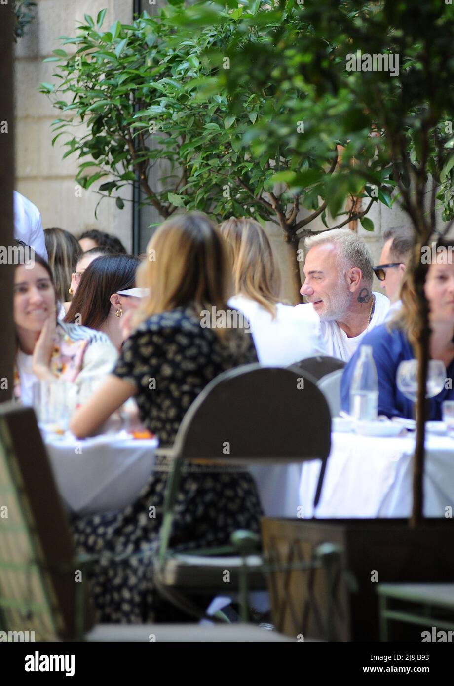Milan, . 16th May, 2022. Milan, 16-05-2022 Gianluca Vacchi and his girlfriend Sharon Fonseca surprised at lunch in a well-known restaurant in the center. After having eaten at the 'Salumaio di Montenapoleone' they go out, and after having given some souvenir photos they take a walk until they reach home, leaving their luxurious Rolls Royce in velvet with initials parked near the house with their driver. EXCLUSIVE SERVICE Credit: Independent Photo Agency/Alamy Live News Stock Photo