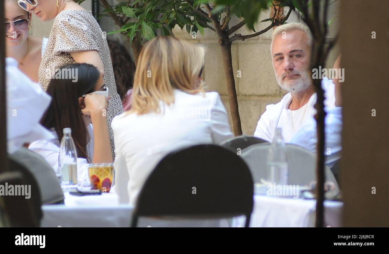 Milan, . 16th May, 2022. Milan, 16-05-2022 Gianluca Vacchi and his girlfriend Sharon Fonseca surprised at lunch in a well-known restaurant in the center. After having eaten at the 'Salumaio di Montenapoleone' they go out, and after having given some souvenir photos they take a walk until they reach home, leaving their luxurious Rolls Royce in velvet with initials parked near the house with their driver. EXCLUSIVE SERVICE Credit: Independent Photo Agency/Alamy Live News Stock Photo