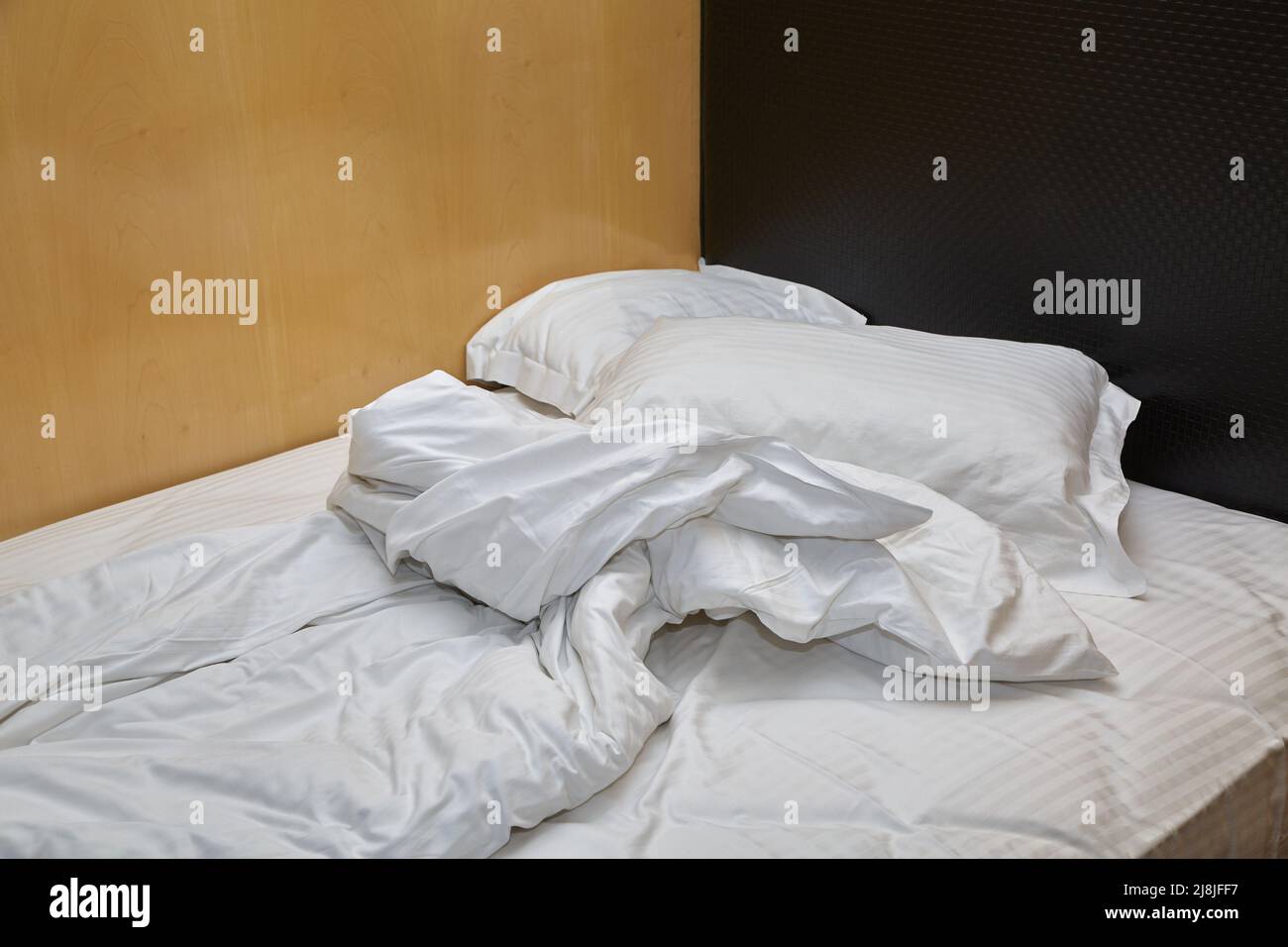 Hotel bed closeup Stock Photo