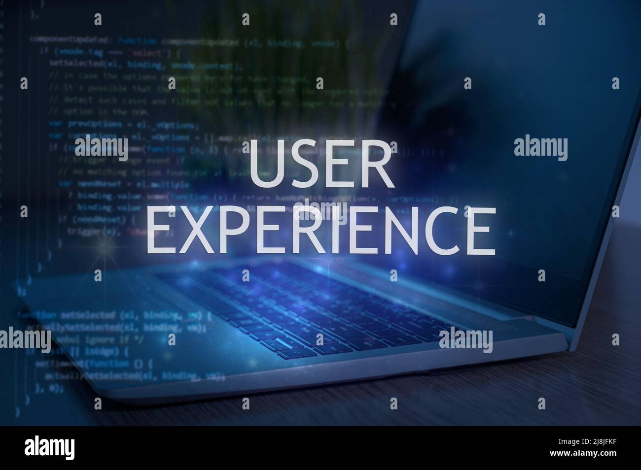 User experience inscription against laptop and code background. Technology concept. Stock Photo