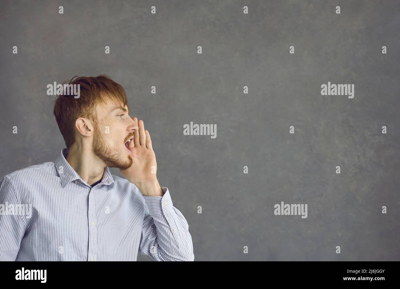 Furious angry young business man yelling and shouting Stock Photo