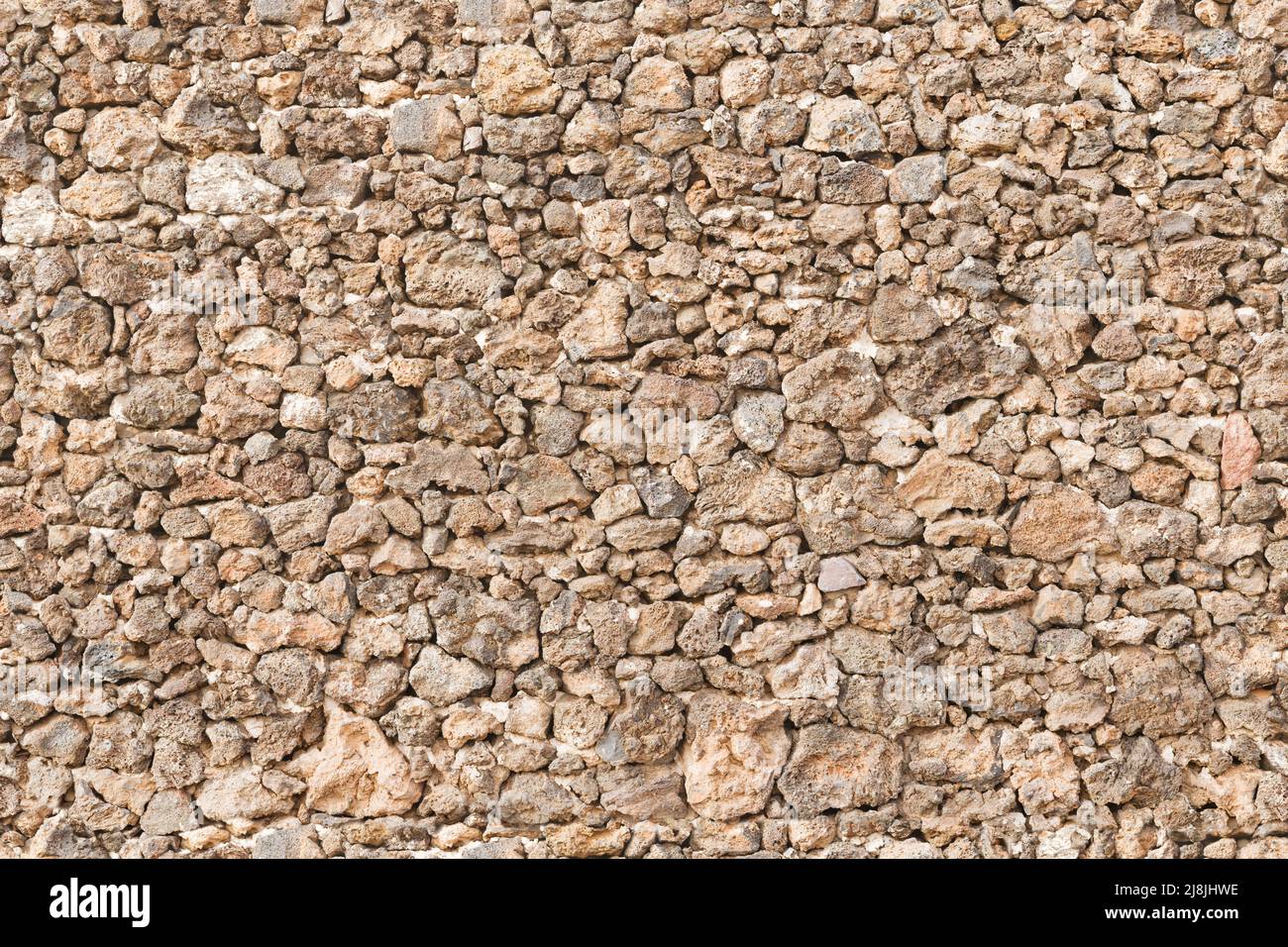 Dry stone wall, drystone walling. Seamless repeating (tileable) pattern, texture or background. Stock Photo