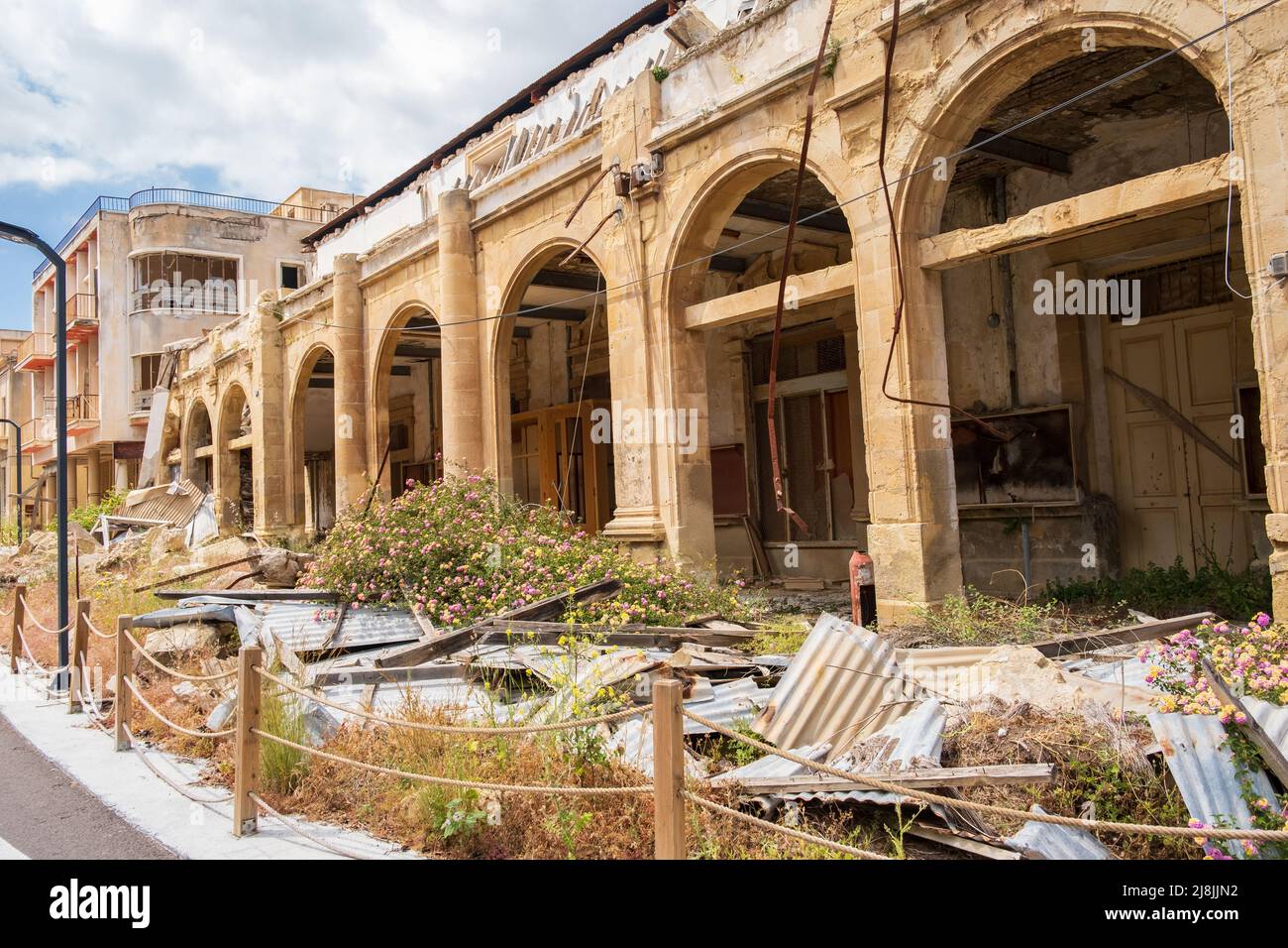 Abandoned buildings and wild vegetation in the Ghost Resort City of Varosha Famagusta in Cyprus Stock Photo