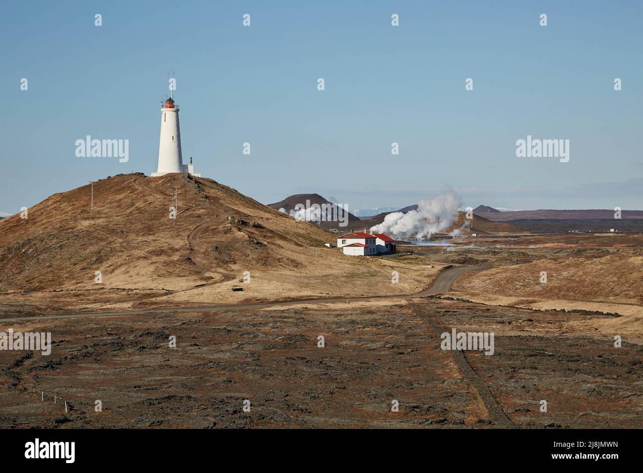 Old White Lighthouse on a hill Stock Photo