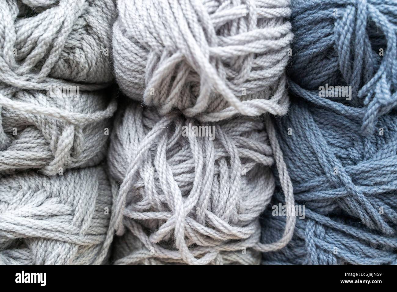 tangles of multicolored thick woolen threads. background. knitting ...