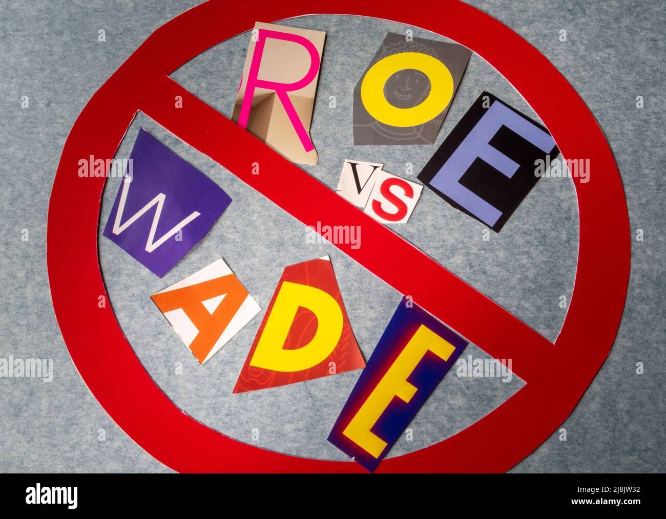 The Concept of 'Cancel Roe vs Wade' using cut-out paper letters in the ransom note effect typography inside The International NO Symbol, USA Stock Photo