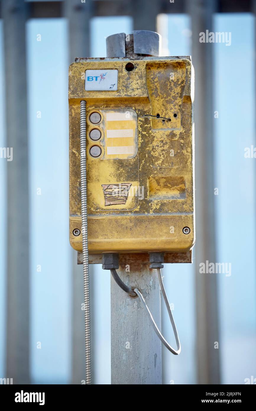 Old Yellow BT Emergency Phone outside the Barking Reach Power station Stock Photo