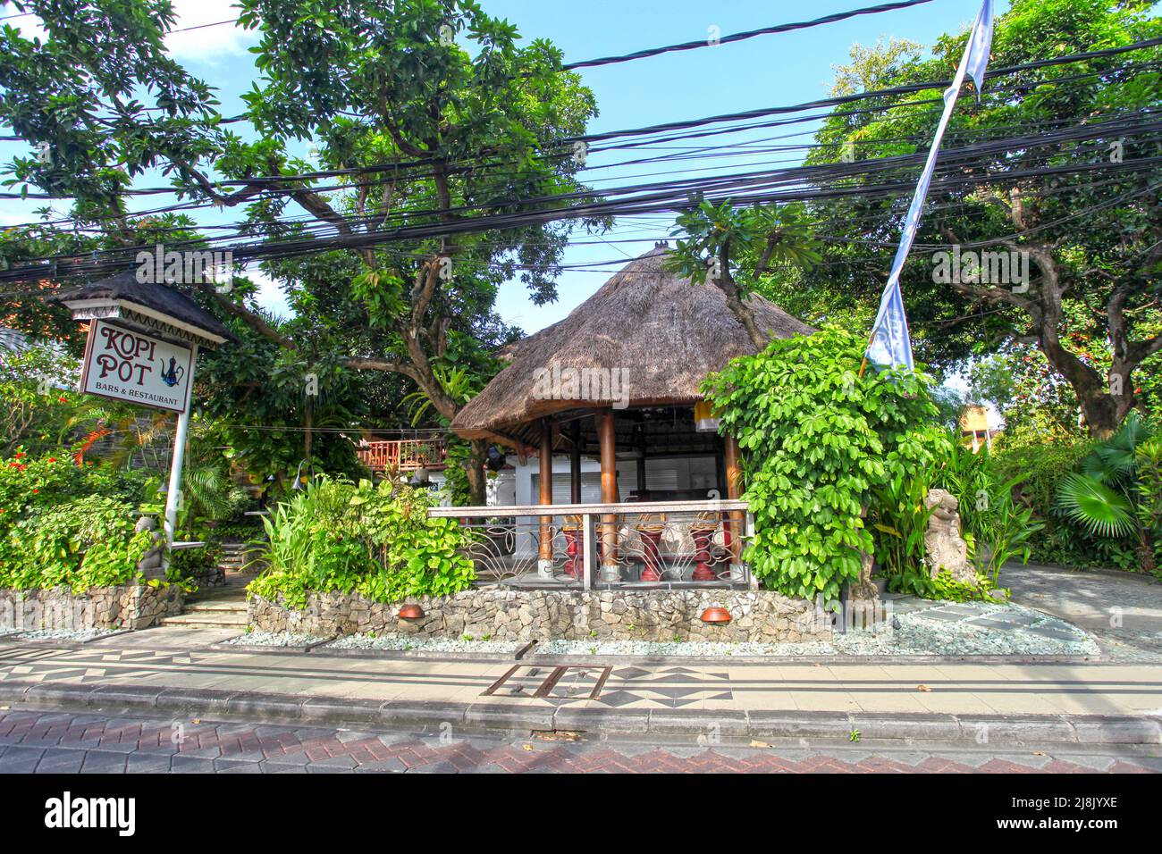 View of the Kopi Pot Bar and Restaurant on Legian Street in Kuta, Bali, Indonesia with no people, still closed during the Covid peropd in early 2022. Stock Photo