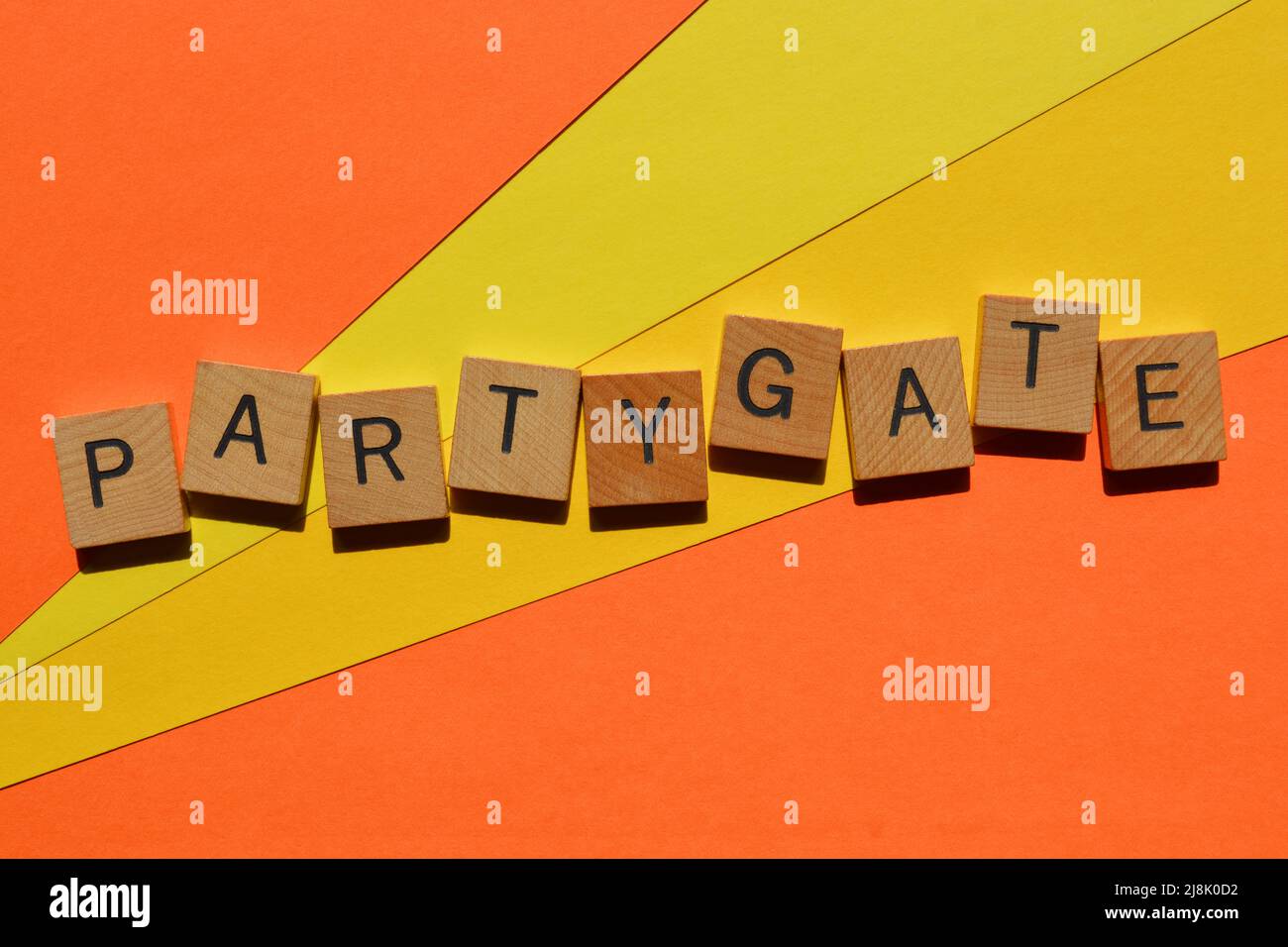 Partygate, word in wooden alphabet letters isolated on bright and colourful background Stock Photo