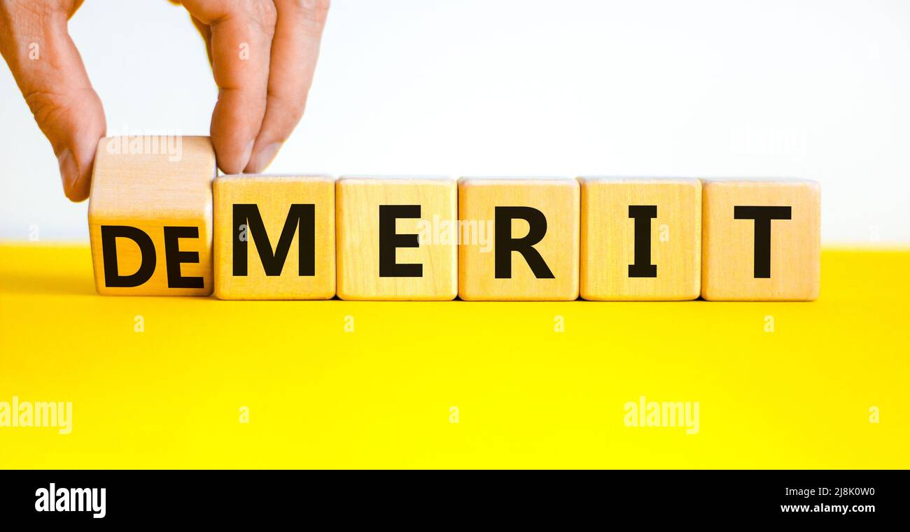 Demerit or merit symbol. Businessman turns wooden cubes and changes the ...