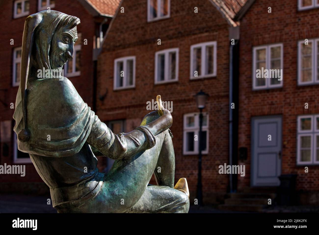 Sculpture Till Eulenspiegel on the fountain in the old town of Moelln, Germany, Schleswig-Holstein, Moelln Stock Photo
