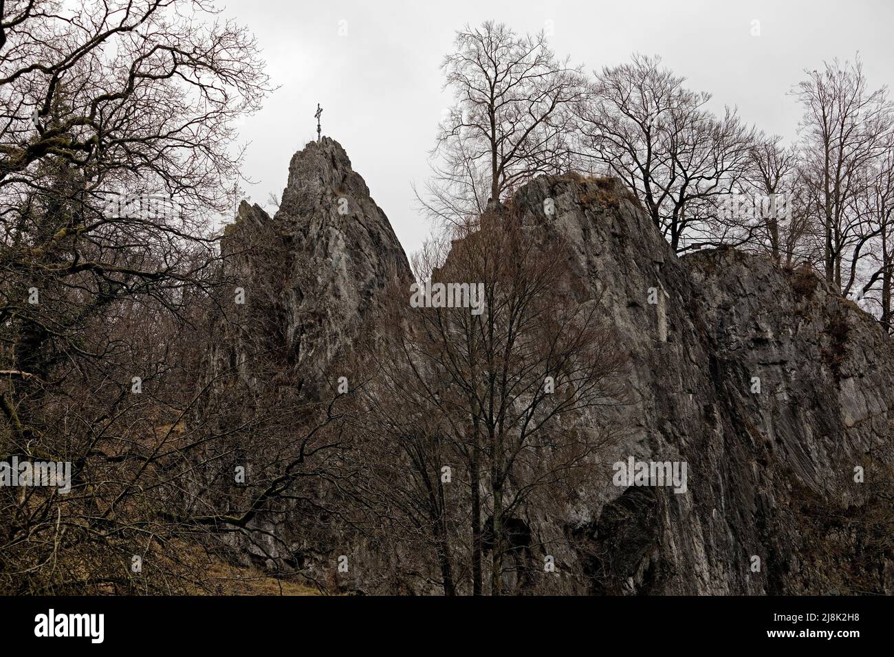 Bilstein rock with summit cross, Rhenish Massif, Germany, North Rhine-Westphalia, Sauerland, Warstein Stock Photo