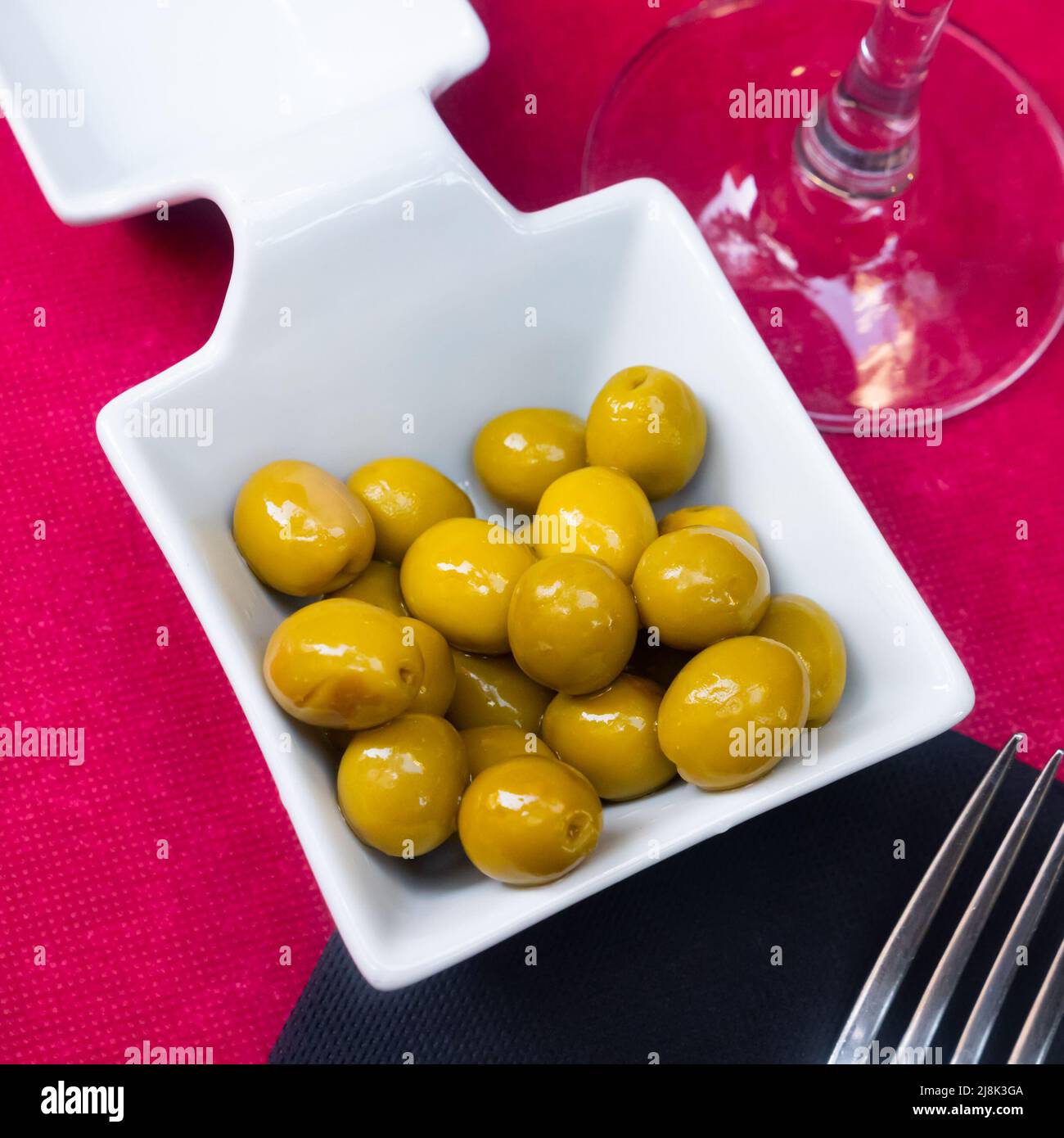 Marinated olives with pits Spanish tapas Stock Photo Alamy