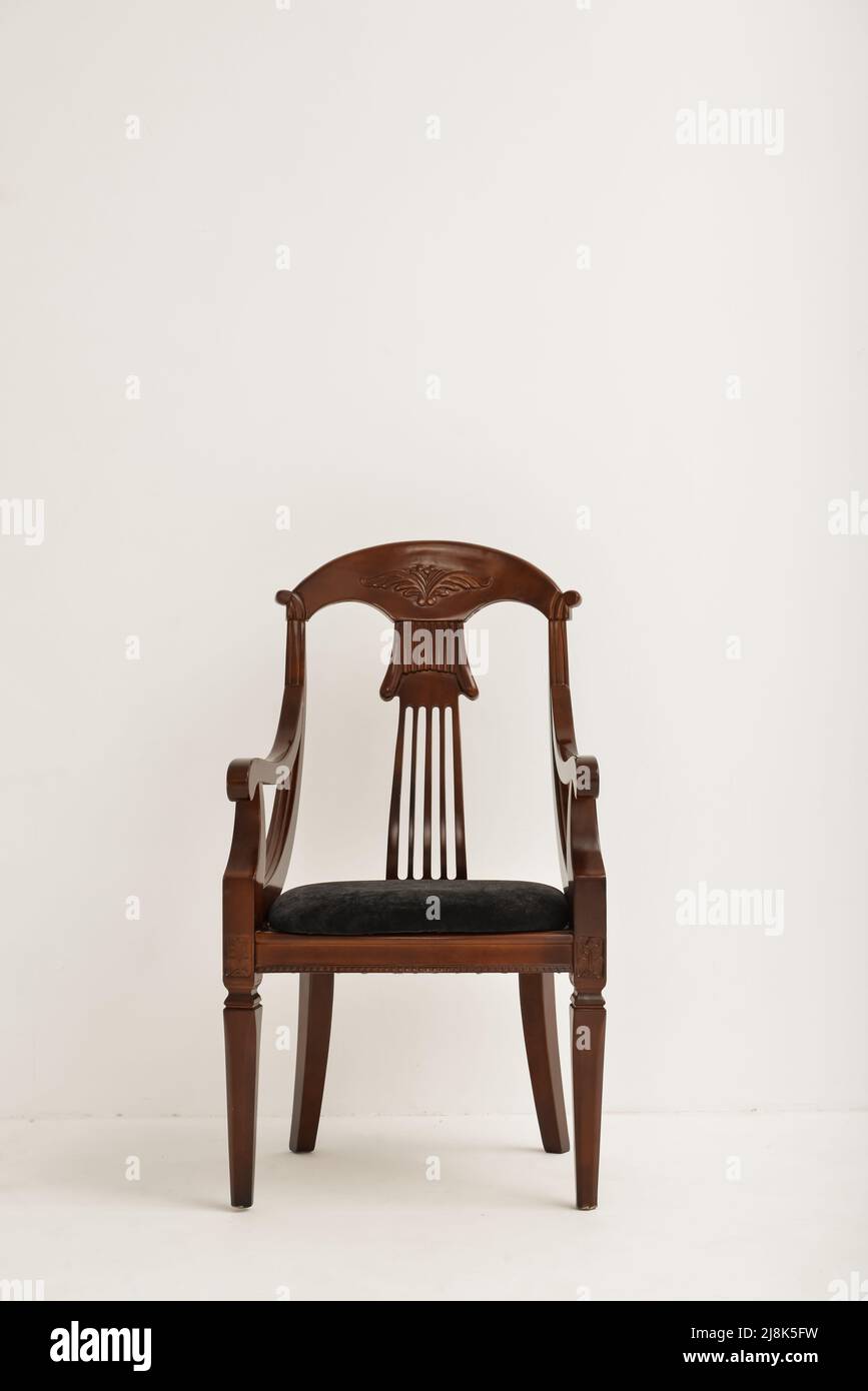 Elegant wooden chair near light wall Stock Photo Alamy